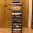 Отдается в дар DVD-стойка с DVD-дисками