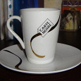 Отдается в дар кофейная чашка с логотипом