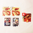Отдается в дар Канадские рождественские/китайско-новогодние марки
