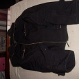 Отдается в дар женская черная куртка 52 размера на осень