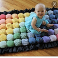 Отдается в дар Заготовки для тактильного одеяла для младенцев (из помпонов)