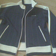 Отдается в дар Куртка-мастерка женская «Sprandi» р-р L, синего цвета с белой вставкой на рукавах.