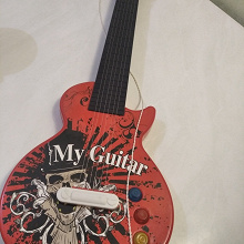 Отдается в дар Игрушка гитара