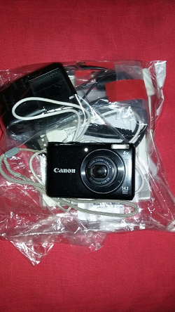Отдается в дар «Цифровой фотоаппарат Canon Power Shot A2200 неисправный и новый аккумулятор для него»