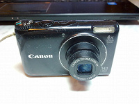 Отдается в дар Цифровой фотоаппарат Canon Power Shot A2200 неисправный и новый аккумулятор для него
