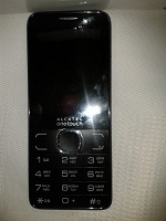 Отдается в дар Новый сотовый телефон Alcatel One Touch 2007D