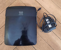 Отдается в дар Wi-Fi роутер Cisco Linksys E1200 (абсолютно рабочий)