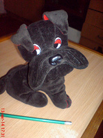 Отдается в дар Симпатичная черная собака-игрушка.