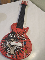 Отдается в дар Игрушка гитара