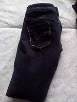 Отдается в дар Черные джинсы со стразами на попе.